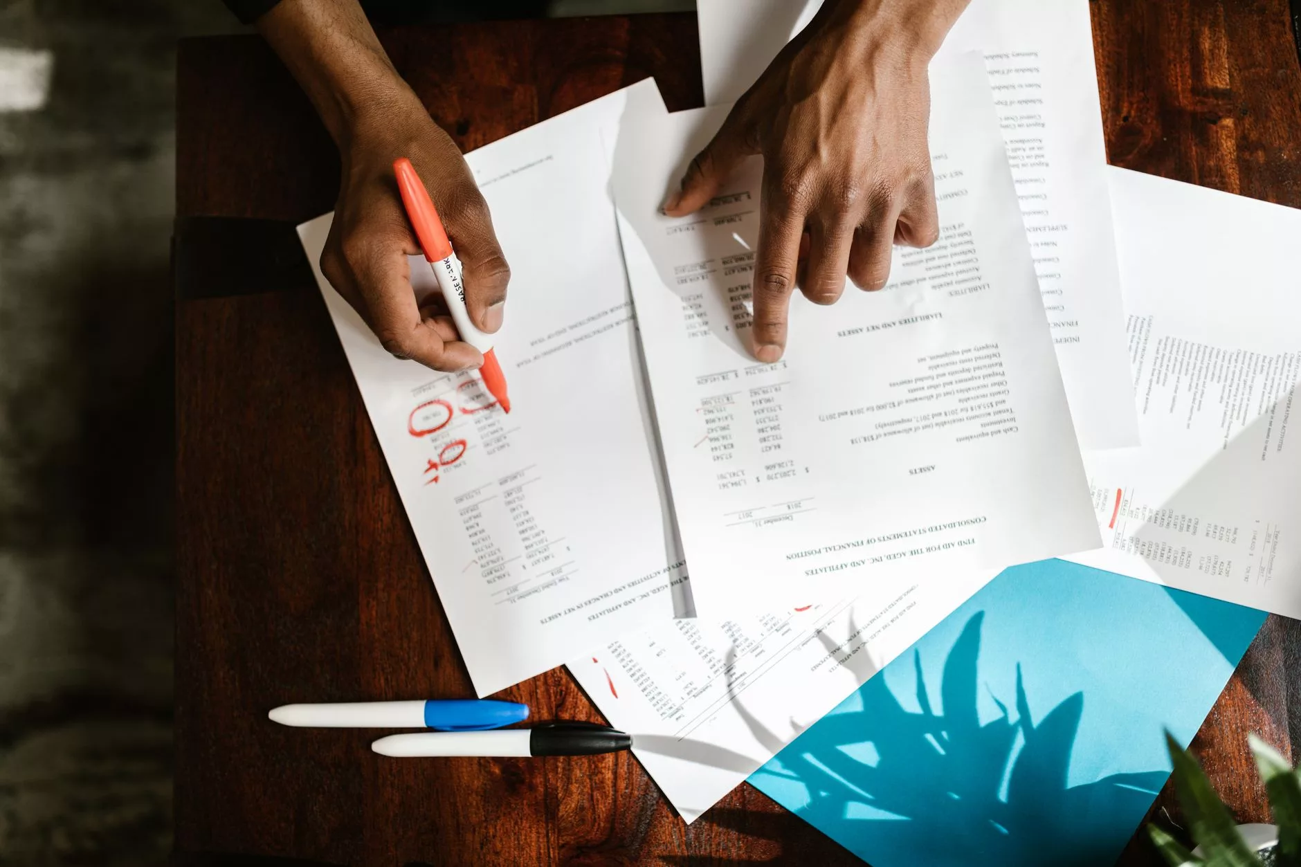 Calculating a Realistic Minimum Annual Budget for WordPress in 2026 financial spreadsheets and budget notes on an office desk