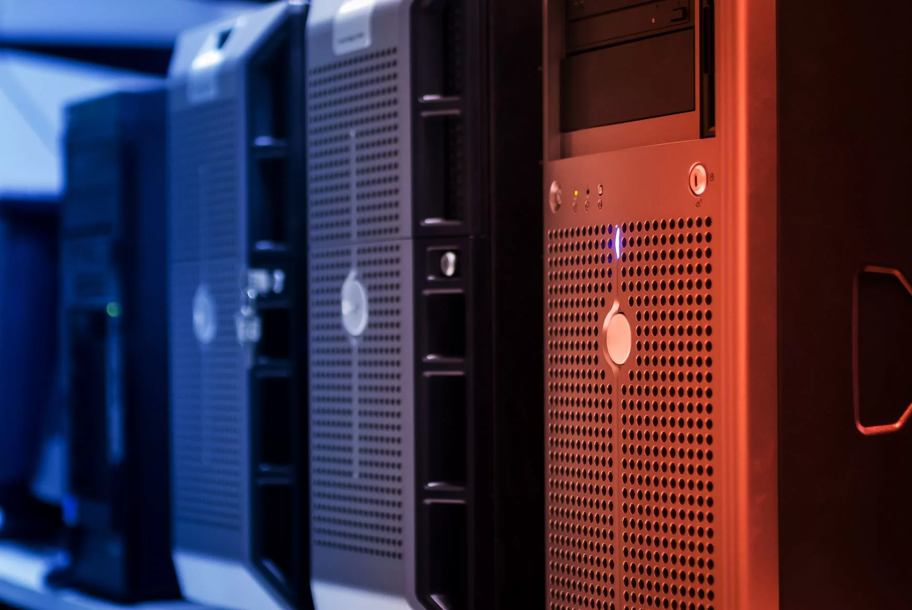 The Mandatory Baseline: Domain Names and WordPress Hosting Expenses glowing blue server racks inside a professional data center