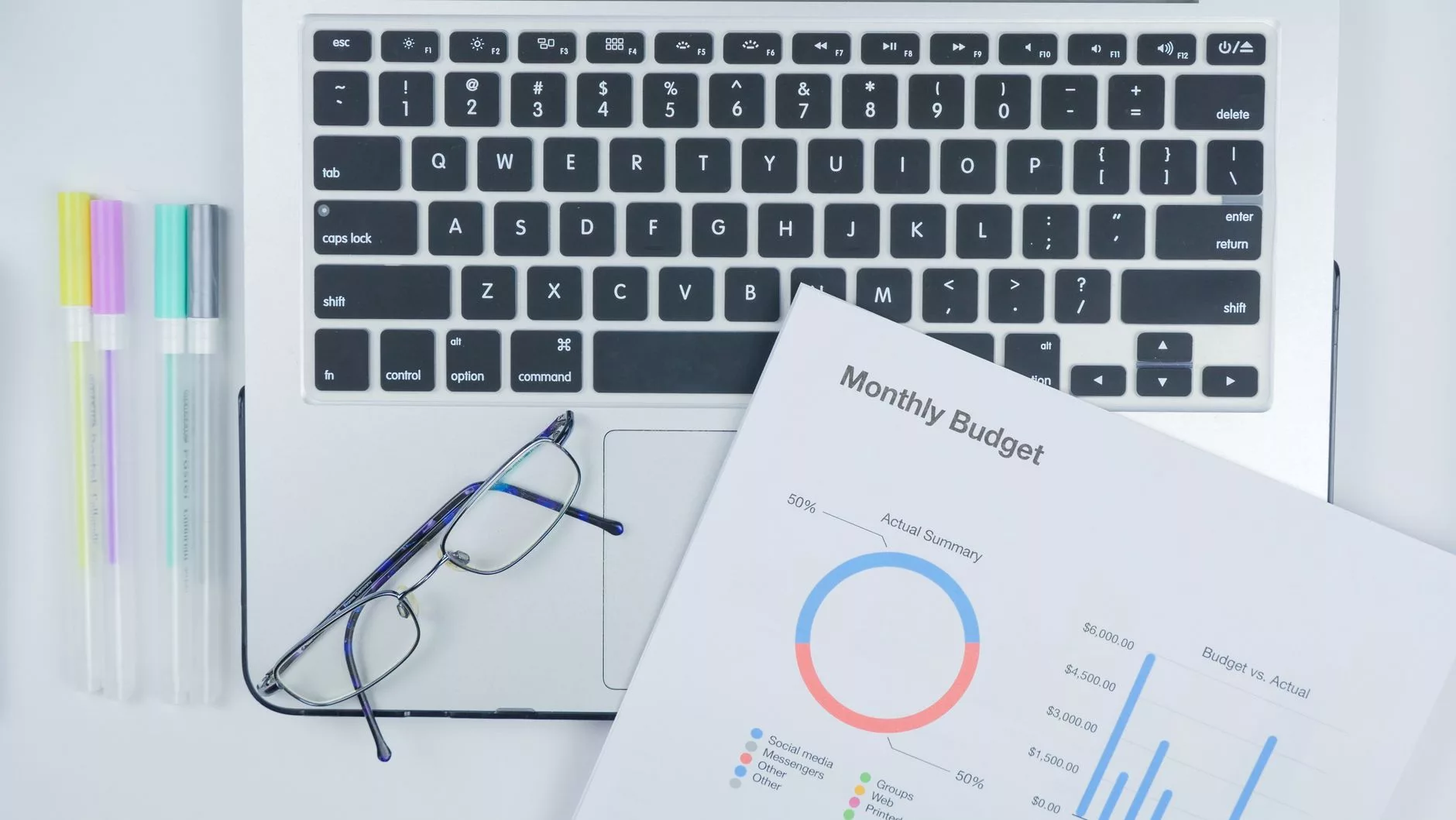 Budgeting for Your Project: Lean Setup vs. Full-Featured Investment businessman reviewing financial analytics and budget charts on a laptop screen