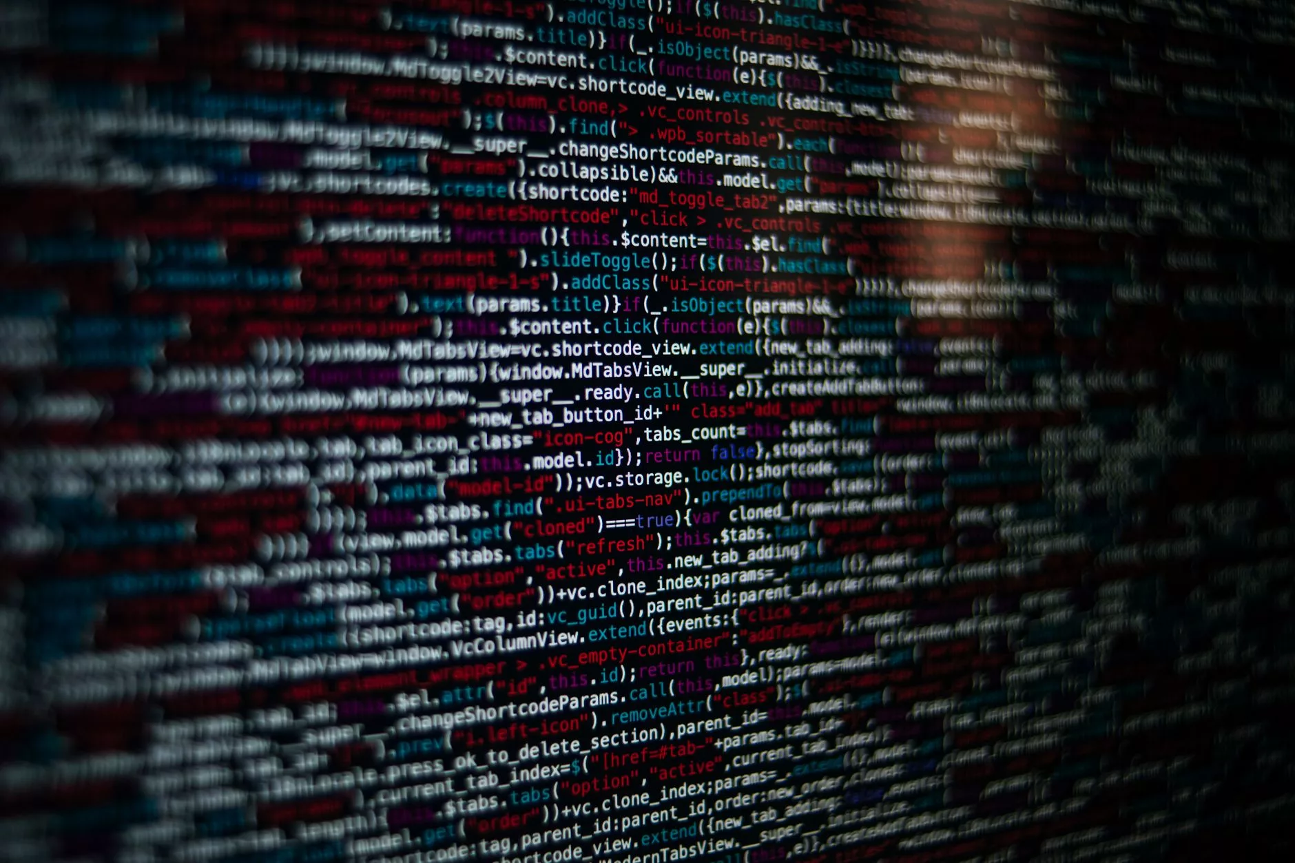 software developer reviewing advanced web performance code on multi-monitor setup
