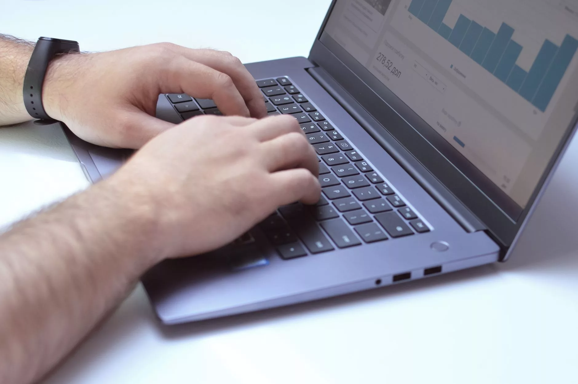 web developer analyzing performance scores and user experience data on a laptop