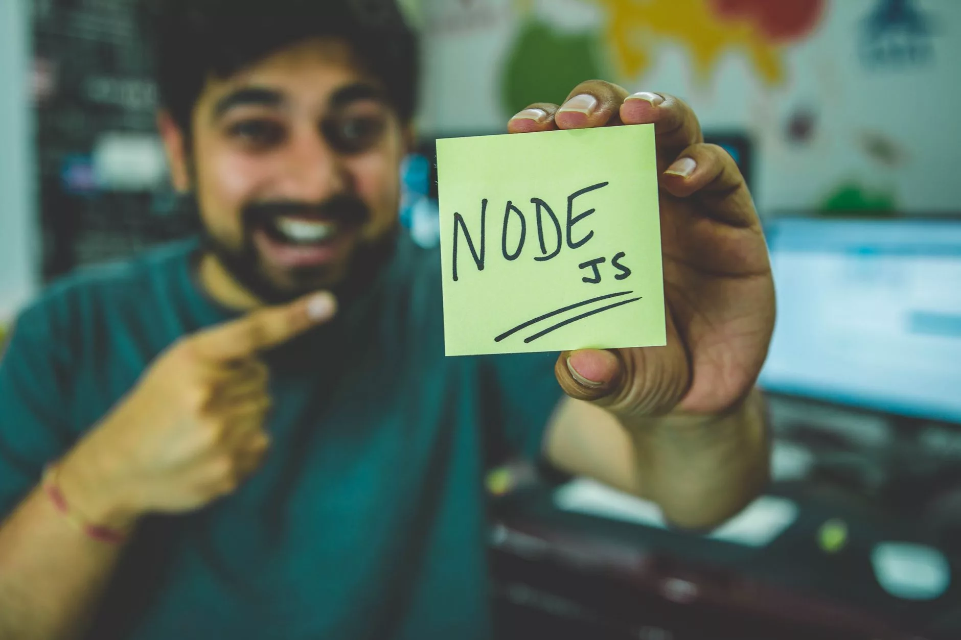 The Evolving Landscape of Node.js in 2026 software developer reviewing release lifecycles on a multi-monitor display