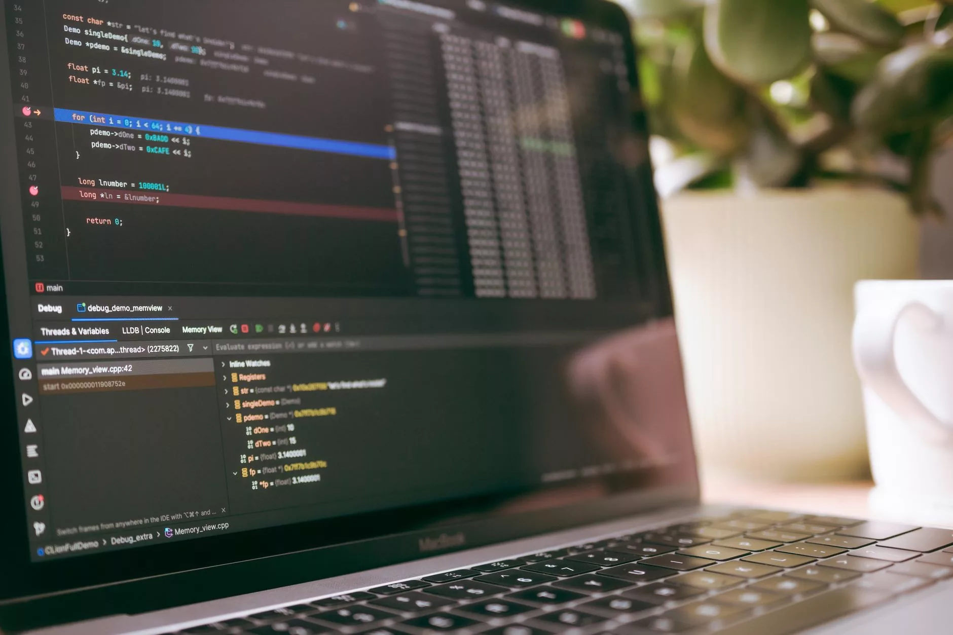 software developer analyzing technical data on a modern laptop screen