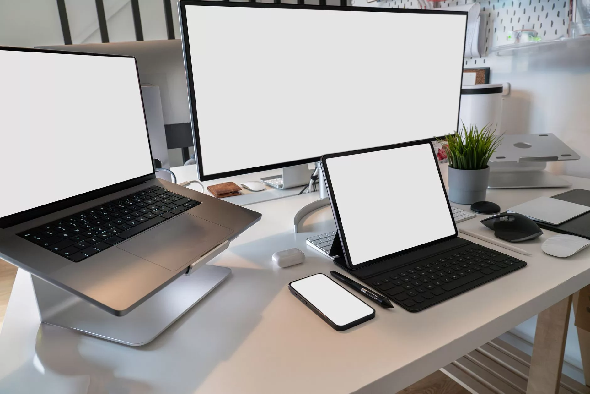 Enqueuing Assets, Avoiding Architectural Pitfalls, and Testing A web developer testing a custom WordPress theme on multiple digital devices across a workbench