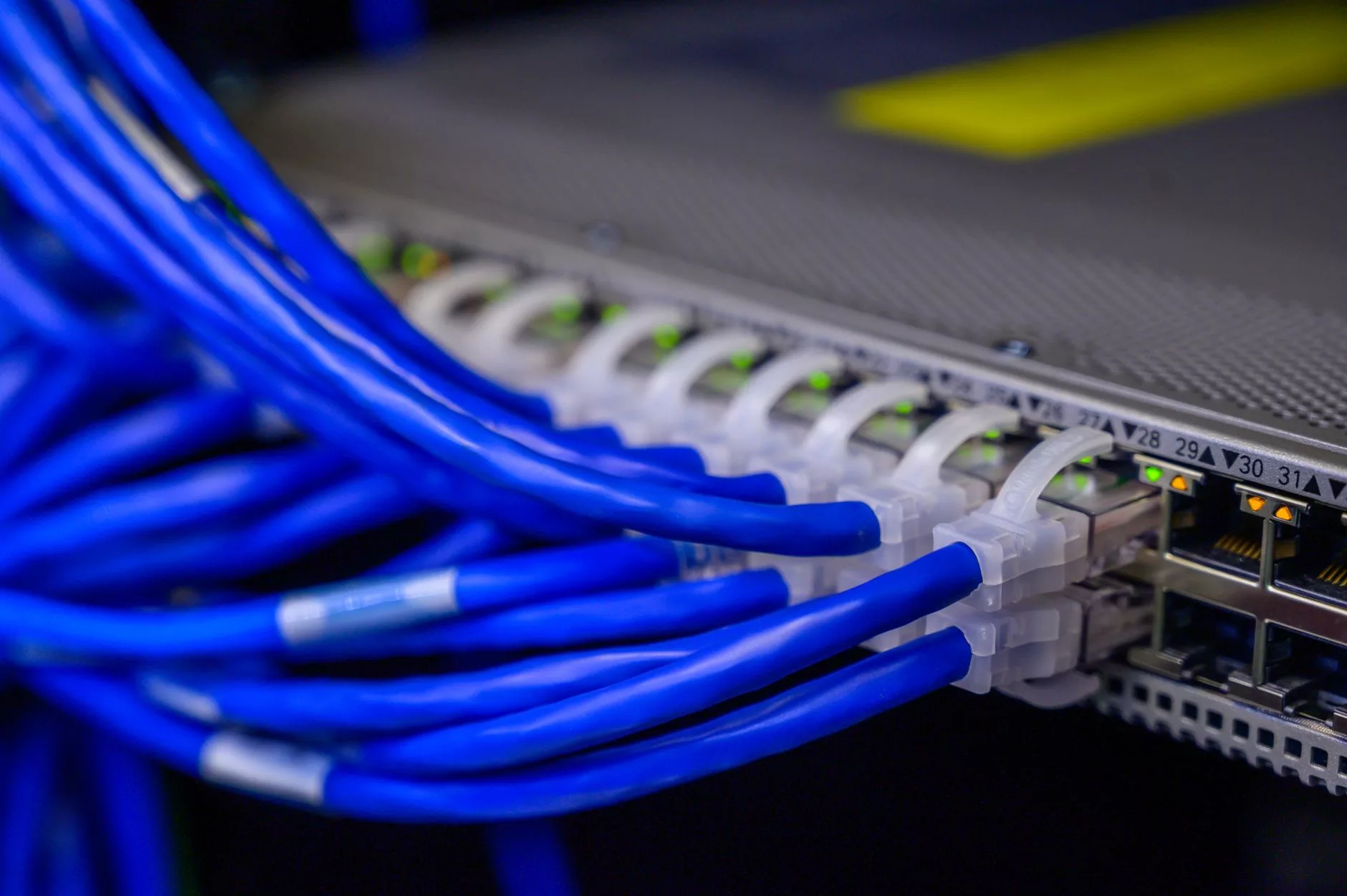 Fixing LCP Bottlenecks and Server Response Issues modern server rack equipment glowing with blue lights in a data center