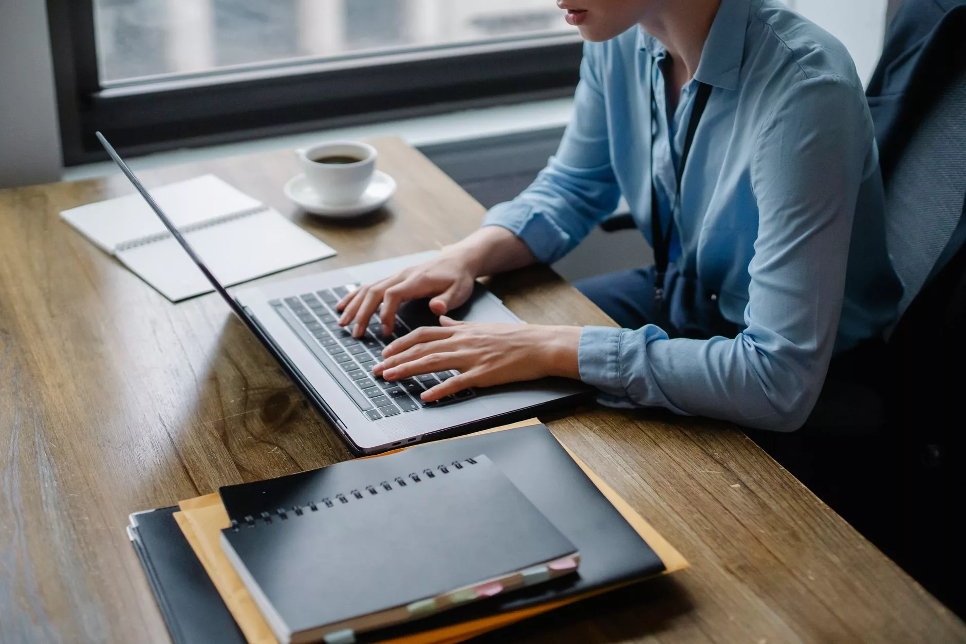 Foundations of Google Business Profile and Local SEO business owner entering company information into a laptop computer at desk