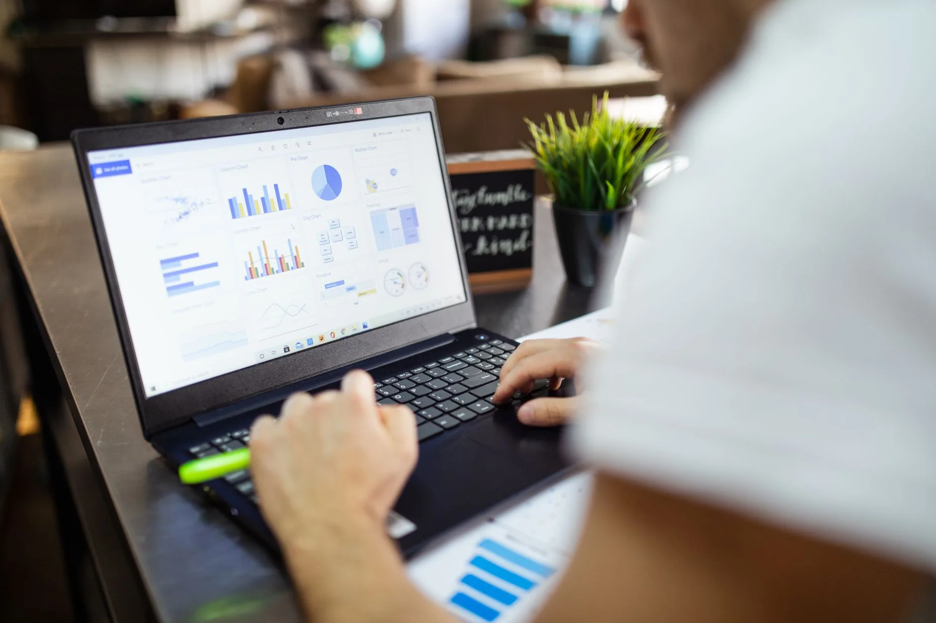 digital marketer analyzing campaign metrics on a modern laptop screen