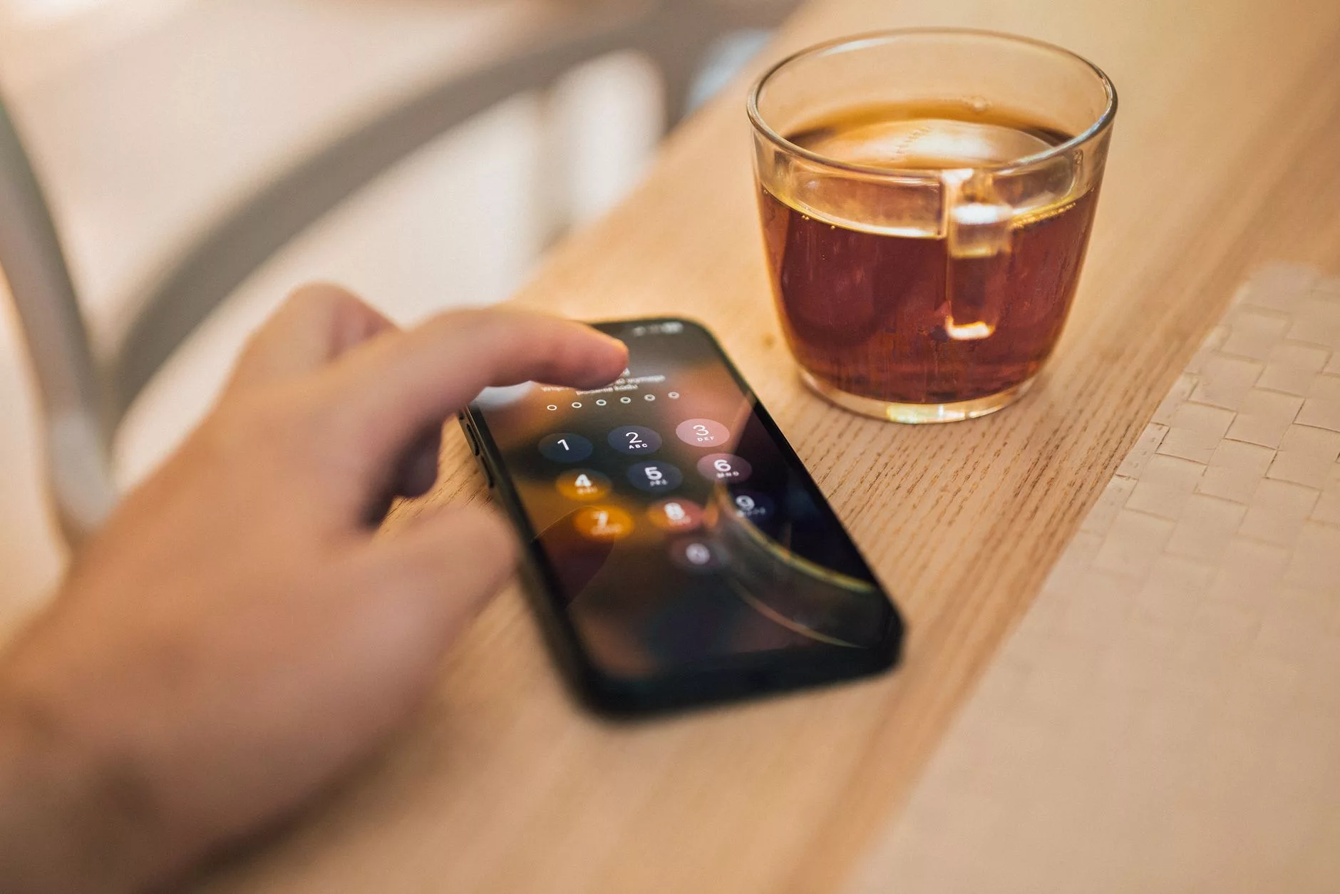 user checking a verification code on a mobile phone for secure login
