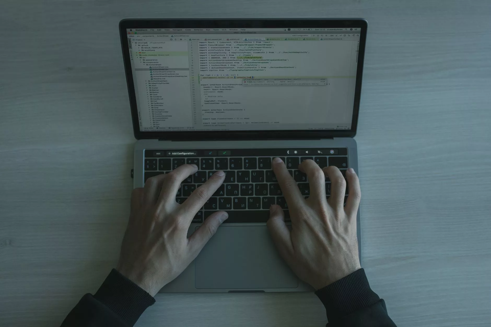 Mastering PHP Templates, The Loop, and Template Parts Close-up of a programmer writing PHP source code on a laptop screen in a modern workspace