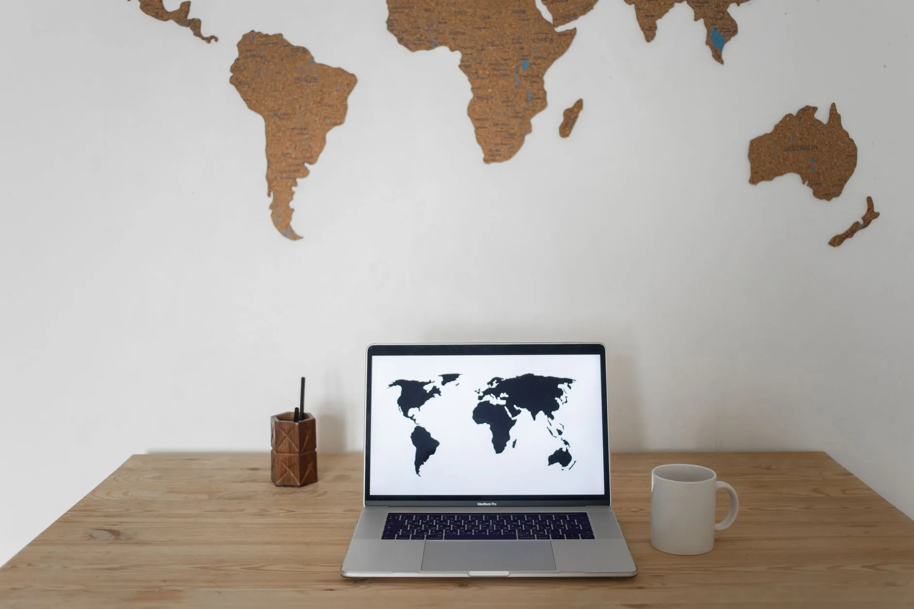 laptop screen displaying international digital marketing analytics and global map