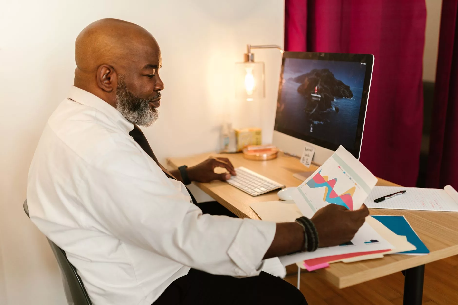 Testing, Monitoring, and Measuring Long-Term SEO Efficiency man reviewing performance graphs and reports in a modern workspace